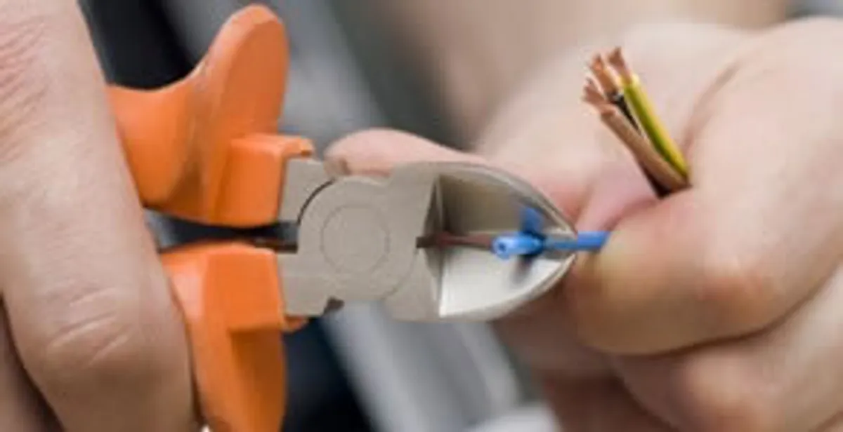 professional electrical services showing precise wire cutting by licensed electricians in Los Angeles, CA